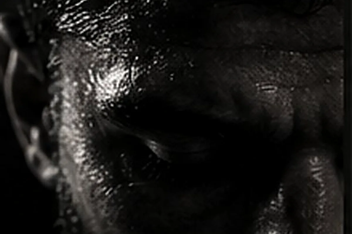 Fighter's face covered in sweat